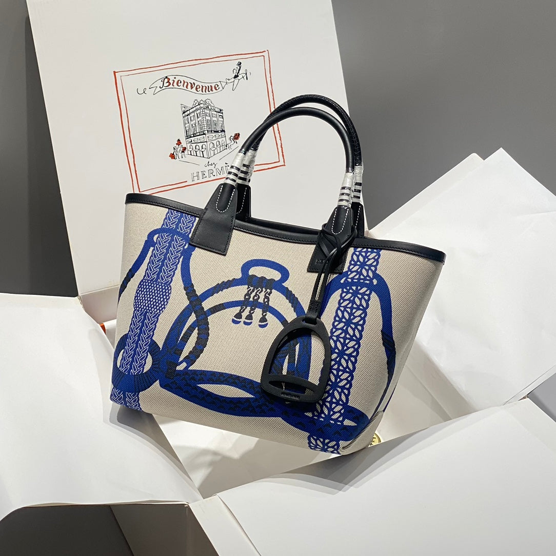 Bolso HM Steeple 28 de piel de becerro negra y lona azul y blanca