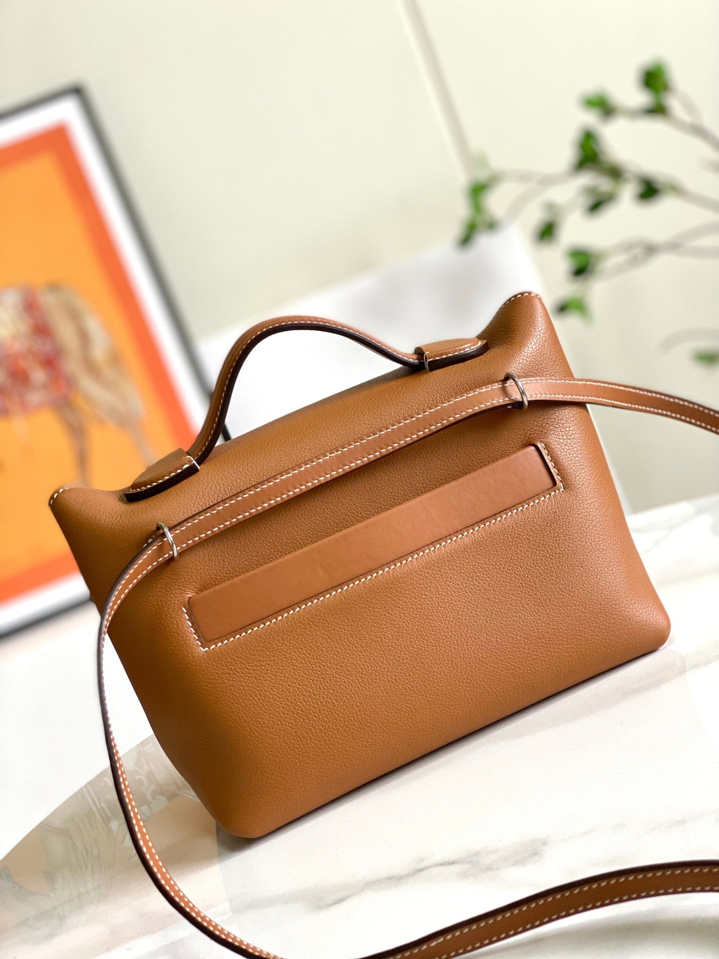 Bolso mini HM 24/24 de 21 cm, piel Evercolor dorada, herrajes plateados