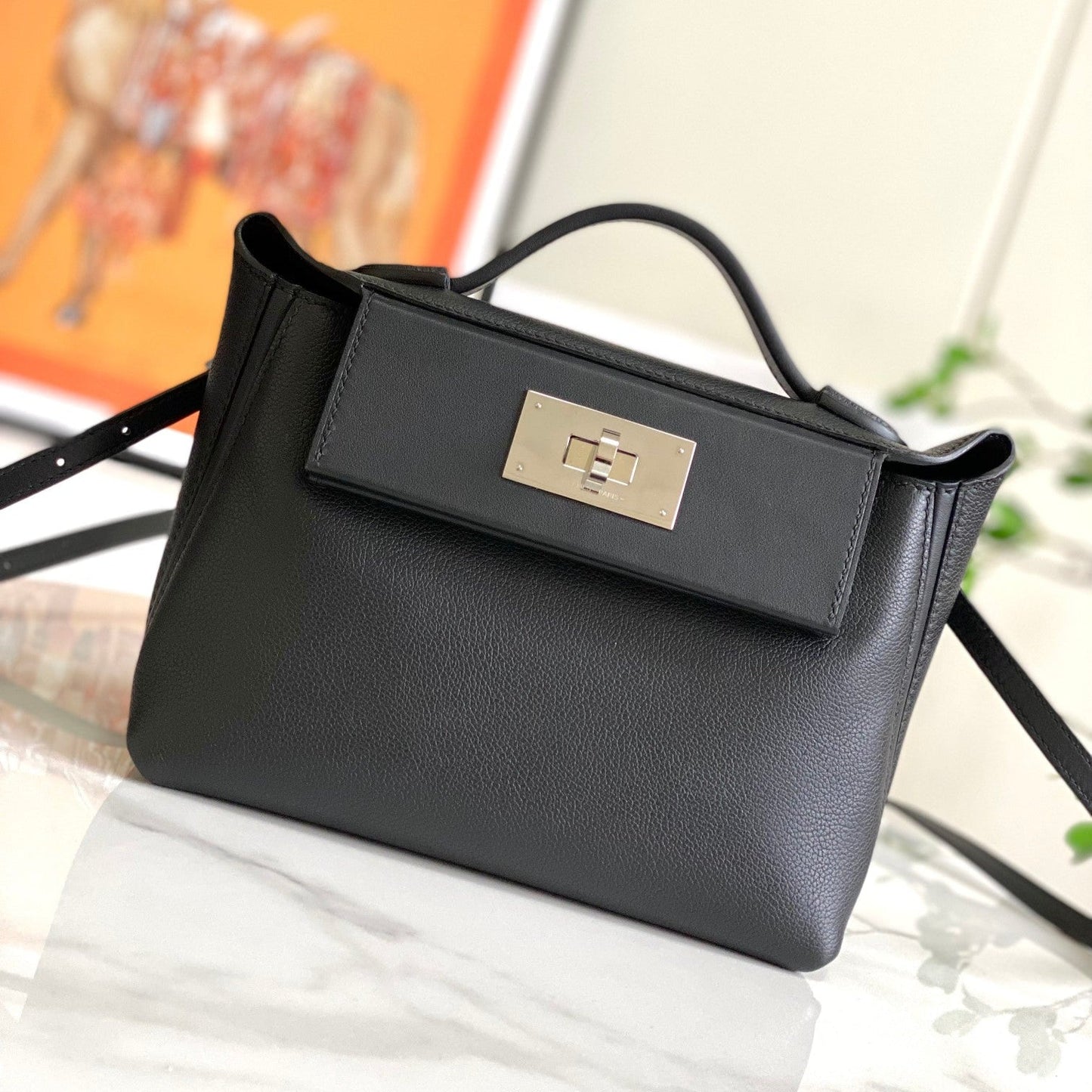Bolso mini HM 24/24 de 21 cm, piel Evercolor negra, herrajes plateados