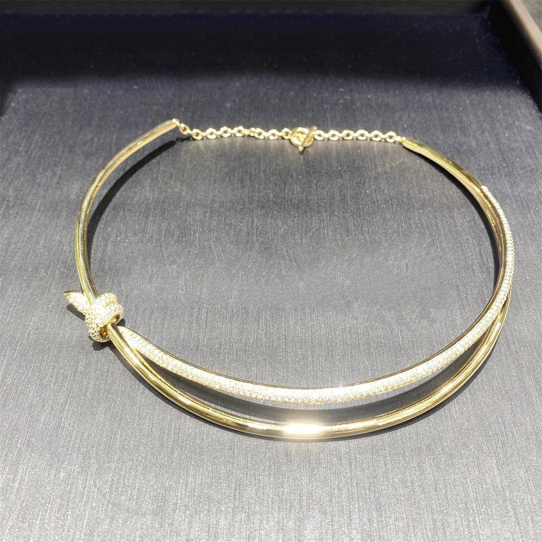 COLLAR DE DOBLE HILERA CON NUDO EN ORO AMARILLO CON DIAMANTES