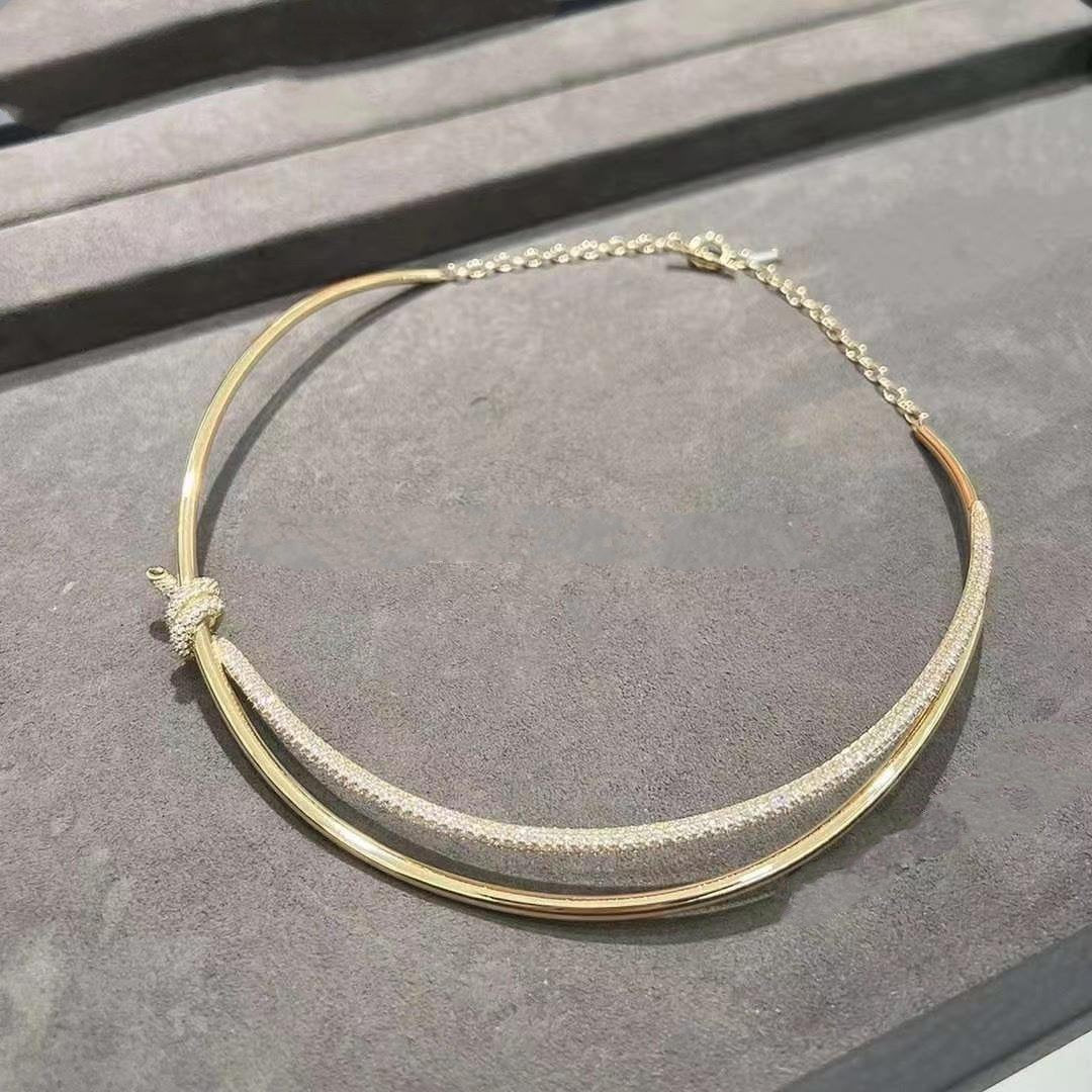 COLLAR DE DOBLE HILERA CON NUDO EN ORO AMARILLO CON DIAMANTES