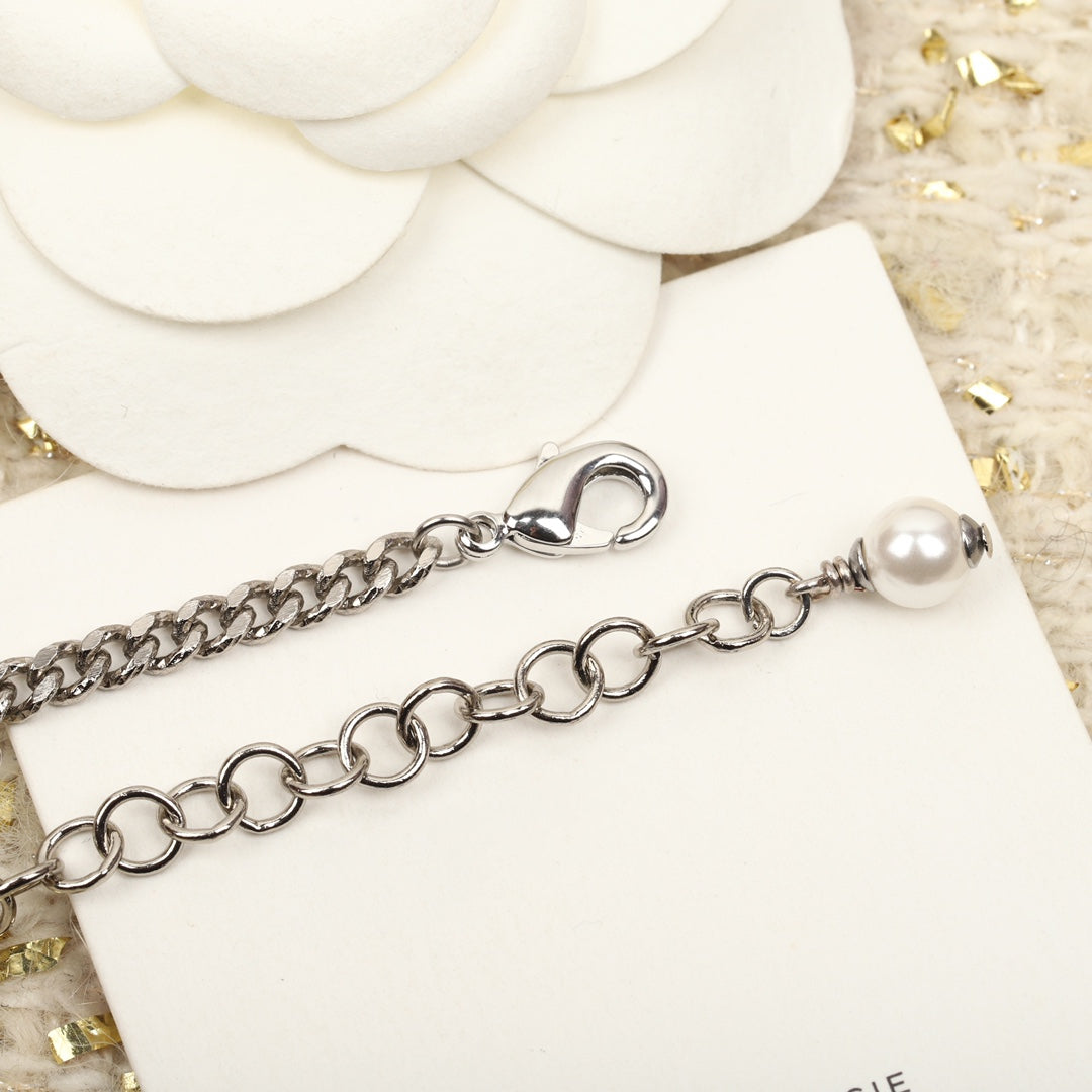 PULSERA DE PLATA MULTIELEMENTO DOBLE C