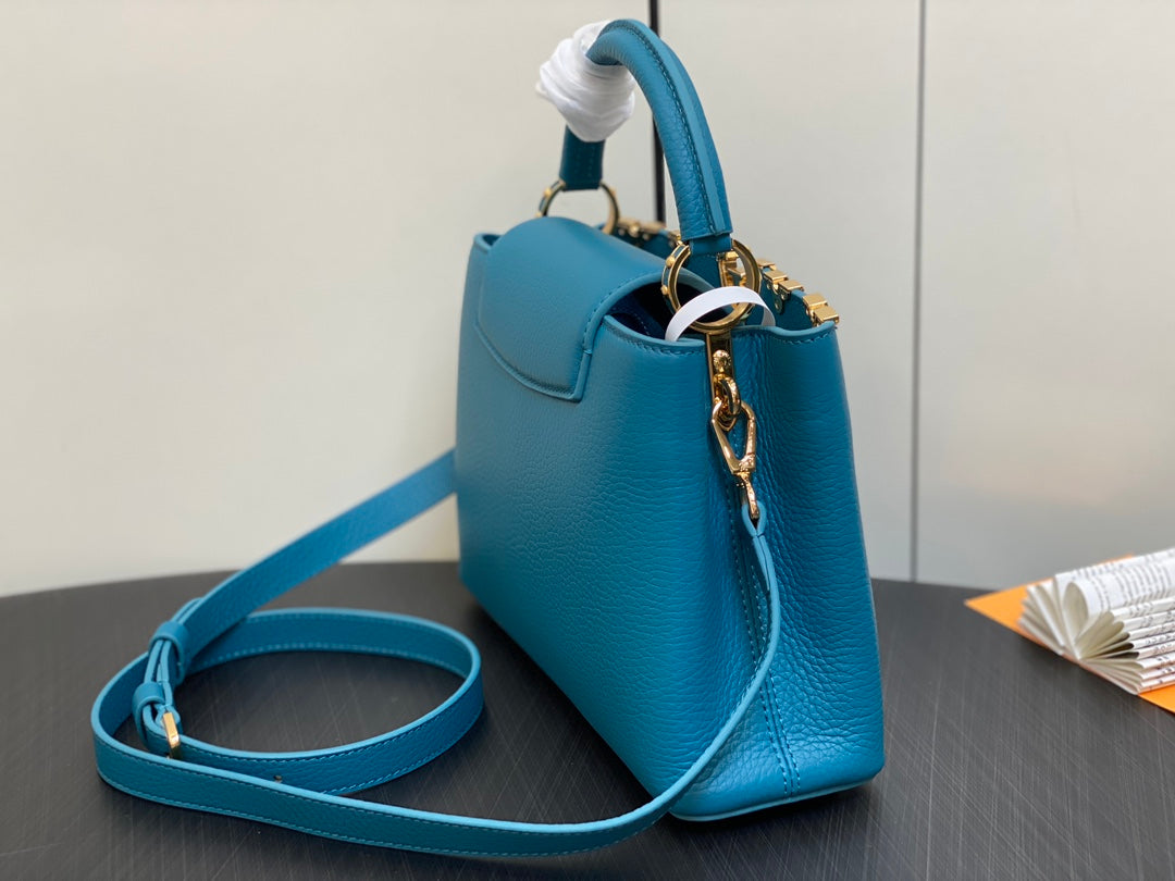 CAPUCINES BB 27 AZUL TAURILLON HARDWARE DORADO