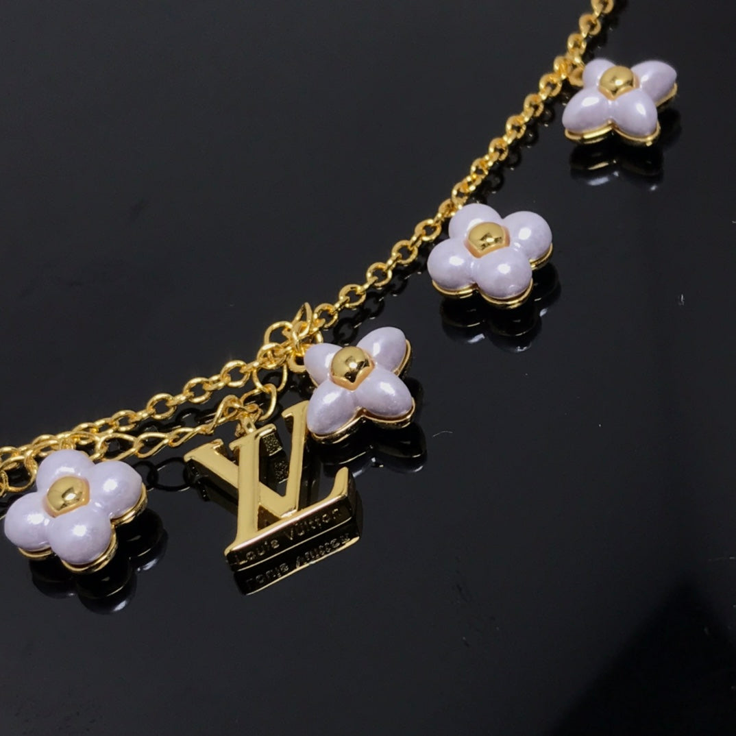 DIANA LOGO 6 MOTIF STAR AND SUN GOLD BRACELET