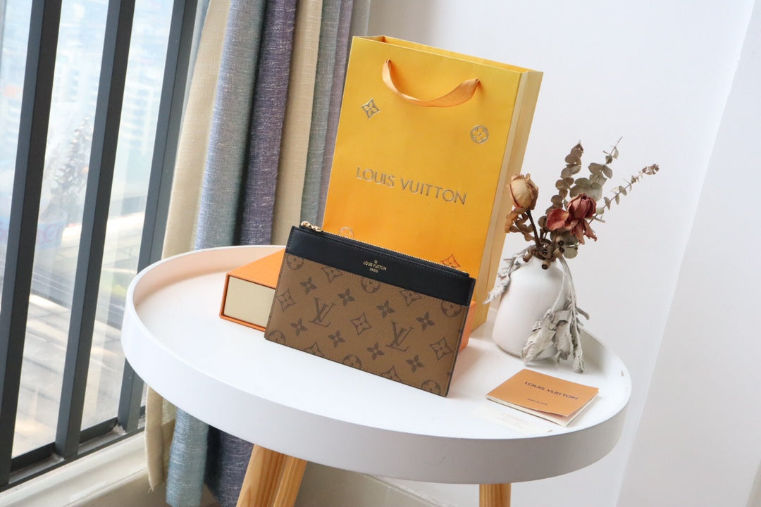 MONEDERO LV SLIM LONA MONOGRAMA REVERSIDA 20 CM