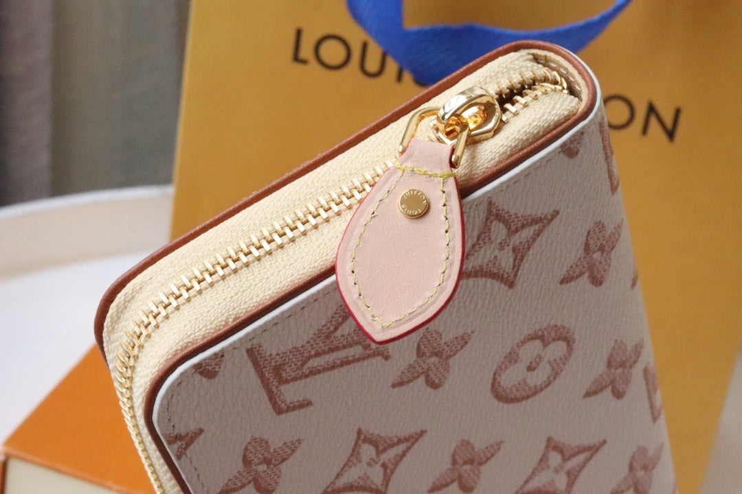 CARTERA CLEMENCE 19.5 LONA MONOGRAMA BLANCO ROSA
