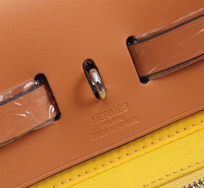 HM HERBAG ZIP 31 LONA LIMÓN Y BRONCE