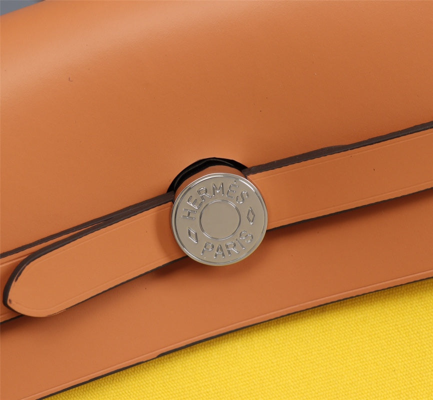 HM HERBAG ZIP 31 LONA LIMÓN Y BRONCE