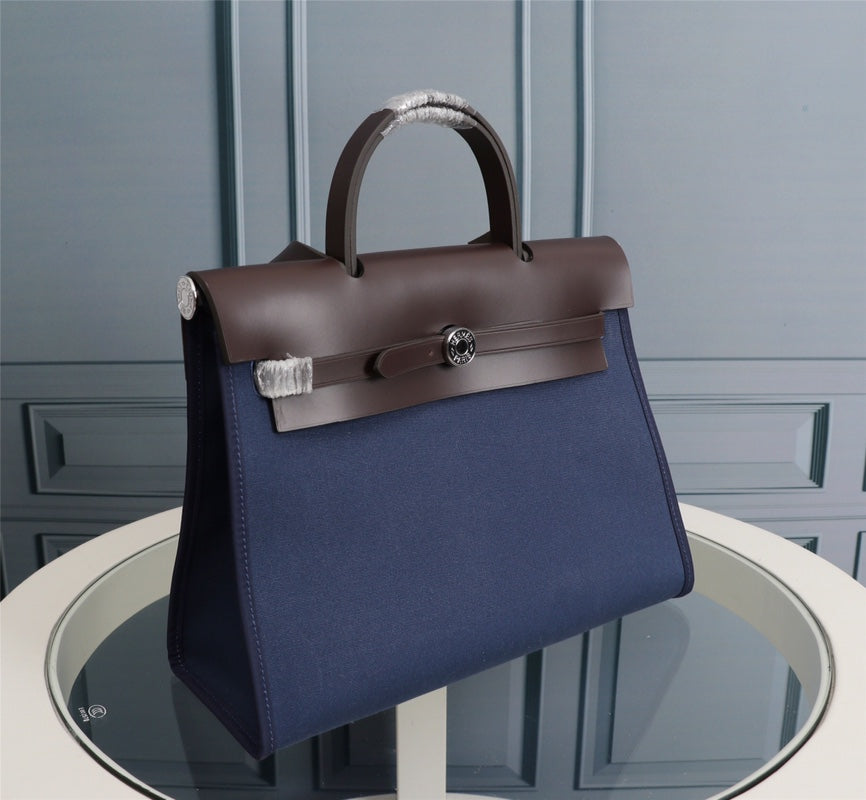 HM HERBAG ZIP 31 LONA AZUL MARINO Y CHOCOLATE
