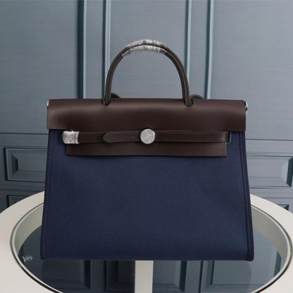 HM HERBAG ZIP 31 LONA AZUL MARINO Y CHOCOLATE