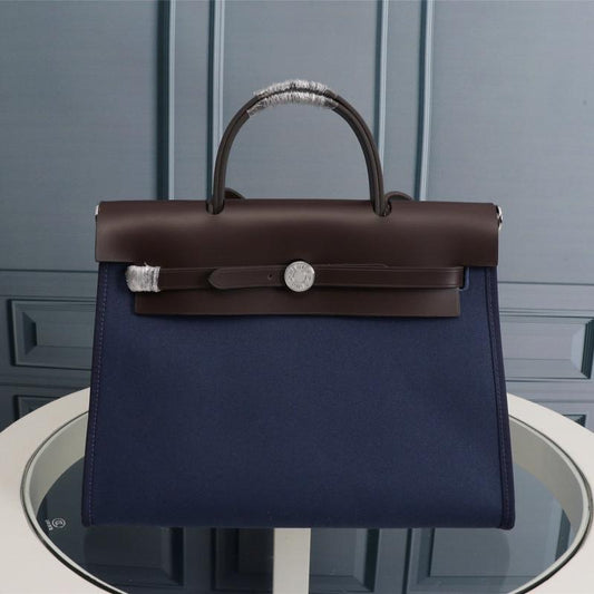 HM HERBAG ZIP 31 LONA AZUL MARINO Y CHOCOLATE