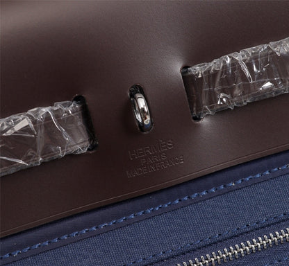 HM HERBAG ZIP 31 LONA AZUL MARINO Y CHOCOLATE