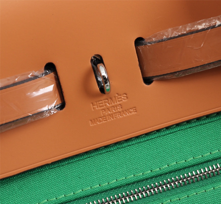 HM HERBAG ZIP 31 LONA VERDE BAMBÚ Y BRONCE