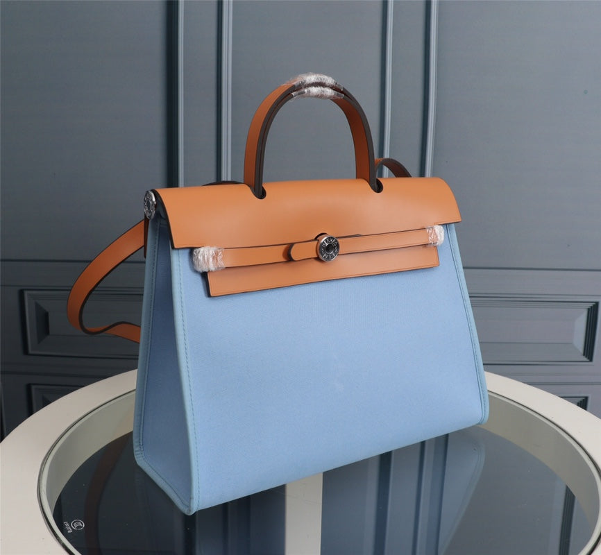 HM HERBAG ZIP 31 LONA CIELO Y BRONCE