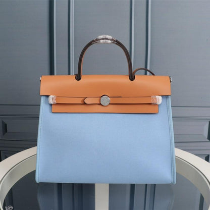 HM HERBAG ZIP 31 LONA CIELO Y BRONCE