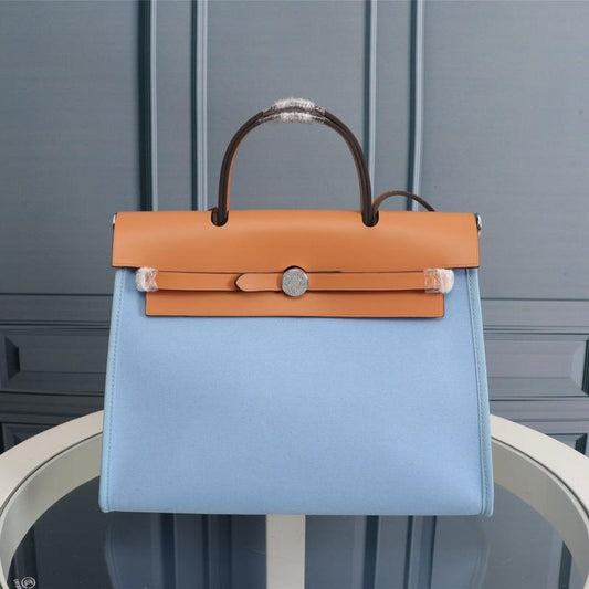 HM HERBAG ZIP 31 LONA CIELO Y BRONCE