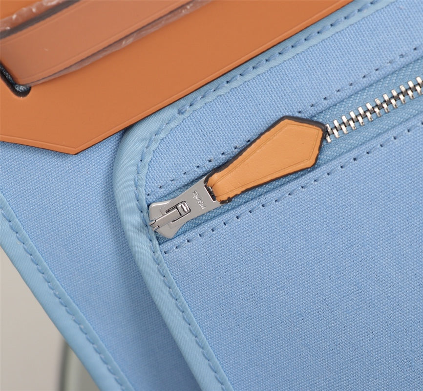 HM HERBAG ZIP 31 LONA CIELO Y BRONCE