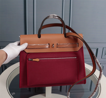 HM HERBAG ZIP 31 LONA ROJO VINO Y COBRE