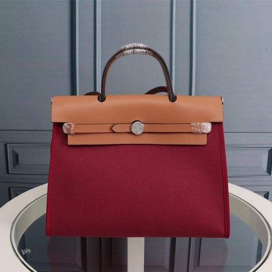 HM HERBAG ZIP 31 LONA ROJO VINO Y COBRE