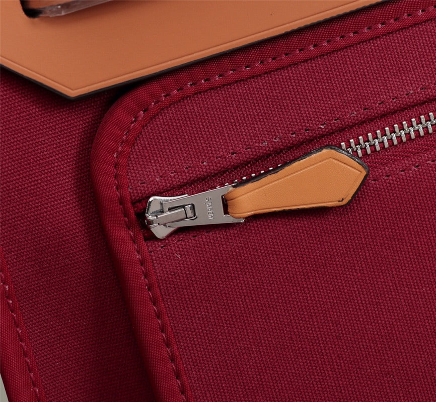 HM HERBAG ZIP 31 LONA ROJO VINO Y COBRE