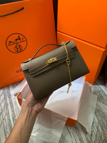 HM KELLY MINI POCHETTE 22 EPSOM MARRÓN CENIZA