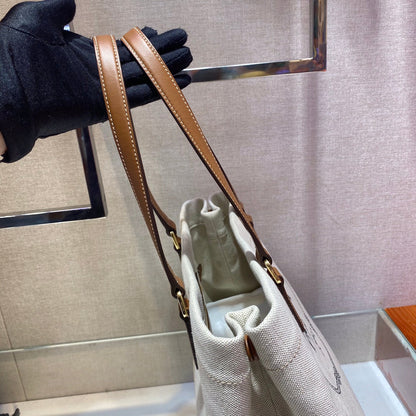 BOLSO TOTE 33 DE LONA BLANCA Y ASA DE PIEL DE BECERRO MARRÓN
