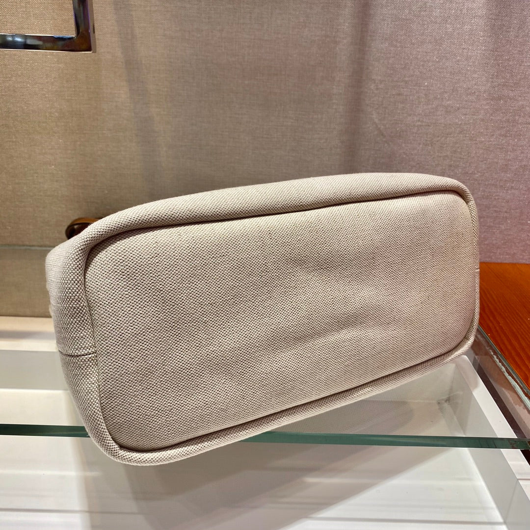 BOLSO TOTE 33 DE LONA BLANCA Y ASA DE PIEL DE BECERRO MARRÓN