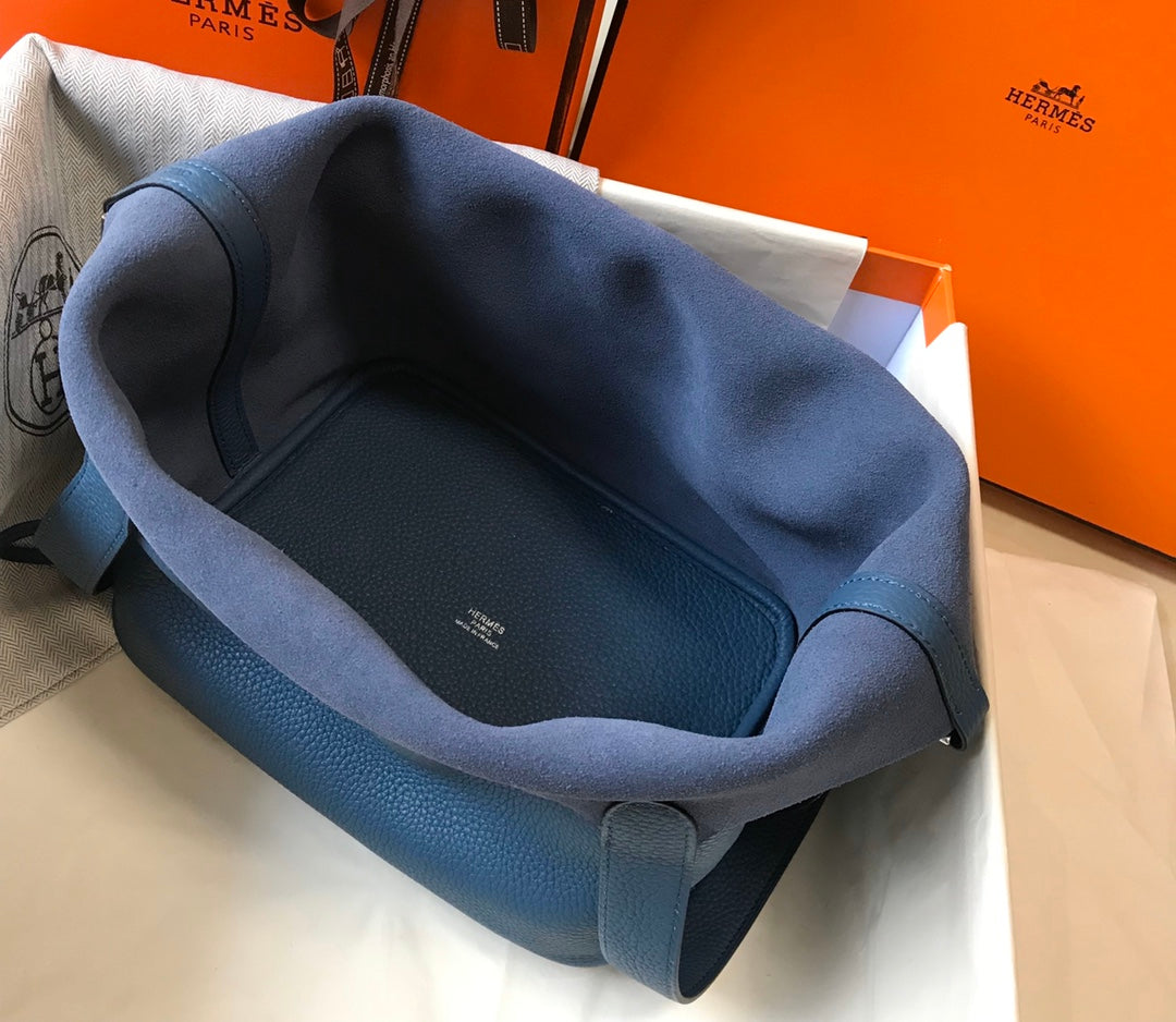 Cerradura picotin, cuero azul Togo, herrajes plateados