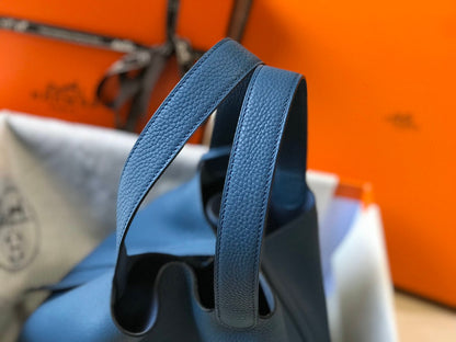Cerradura picotin, cuero azul Togo, herrajes plateados