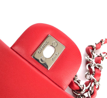 MINI BOLSO RECTANGULAR CON SOLAPA 20CM PIEL DE CORDERO ROJA HERRAMIENTAS PLATEADAS