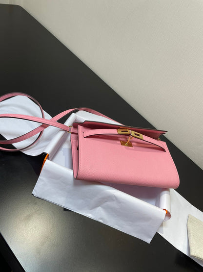 Kelly WOC 20.5 rosa Epsom con herrajes dorados