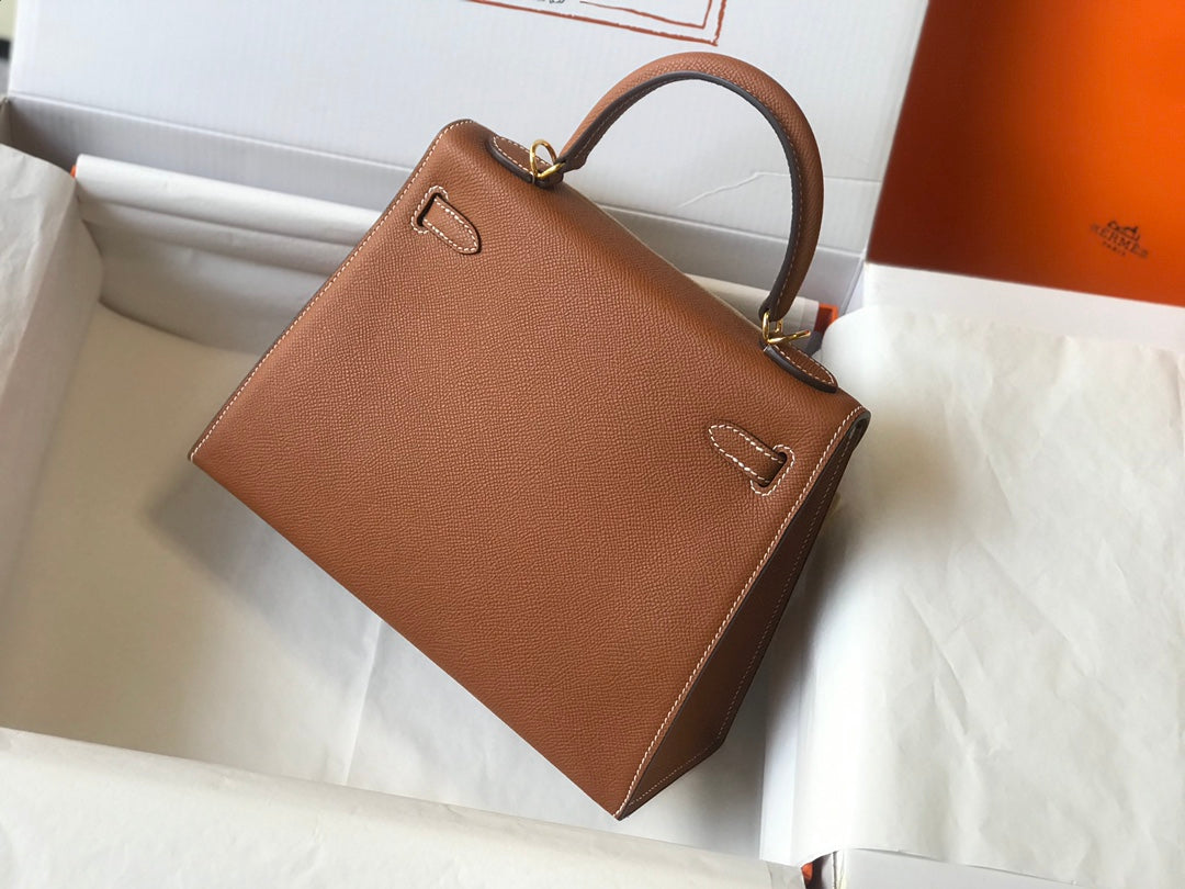 Hm Kelly 32 cm, cuero Epsom marrón oscuro, herrajes dorados