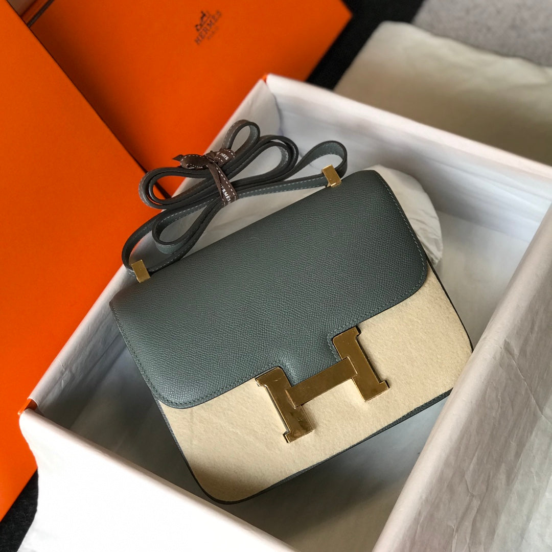Constance 24 azul naranja, cuero Epsom, herrajes dorados
