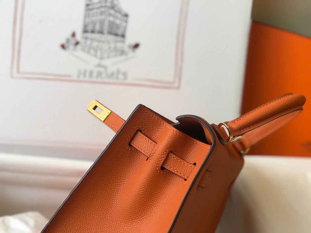 Hm Kelly 32 cm, cuero Epsom naranja, herrajes dorados