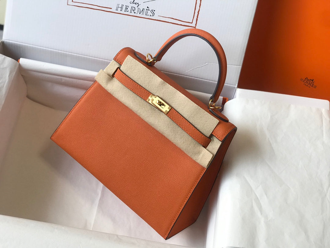 Hm Kelly 32 cm, cuero Epsom naranja, herrajes dorados
