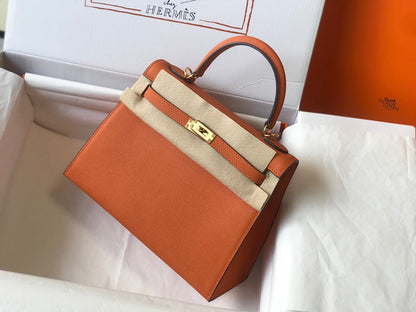Hm Kelly 32 cm, cuero Epsom naranja, herrajes dorados
