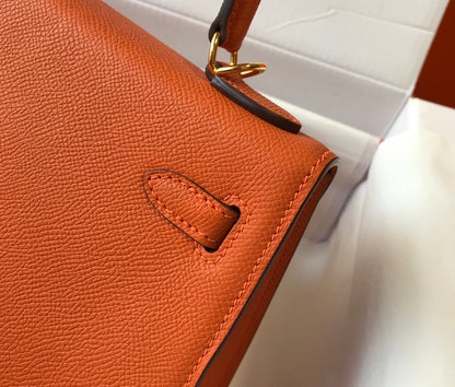 Hm Kelly 32 cm, cuero Epsom naranja, herrajes dorados