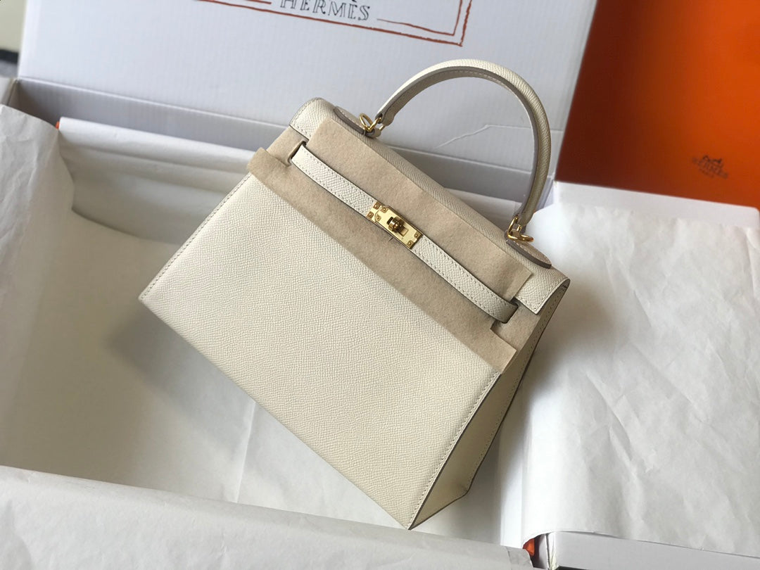 Hm Kelly 32 cm, cuero Epsom blanco, herrajes dorados