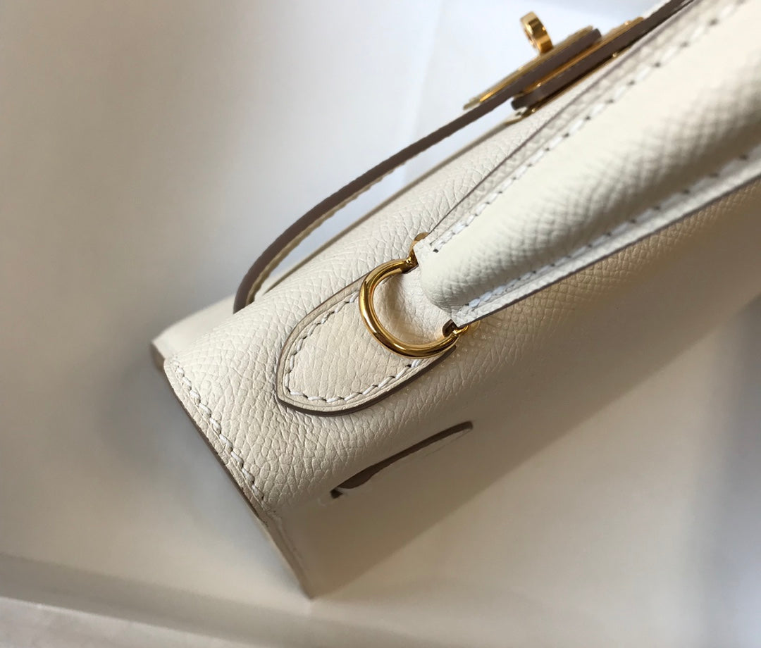 Hm Kelly 32 cm, cuero Epsom blanco, herrajes dorados