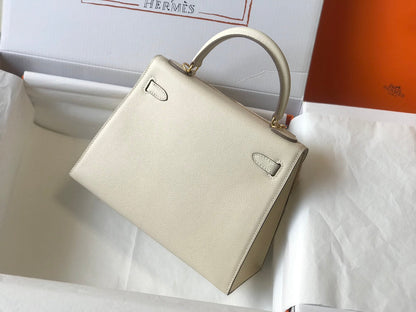 Hm Kelly 32 cm, cuero Epsom blanco, herrajes dorados