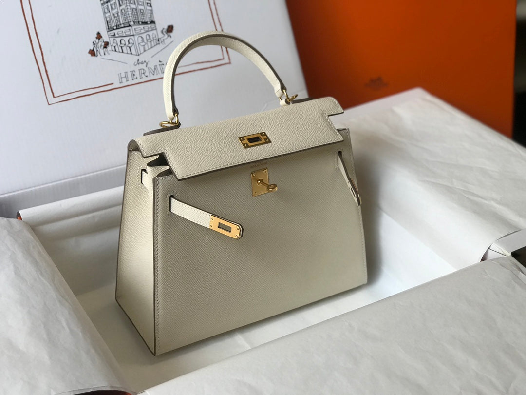 Hm Kelly 32 cm, cuero Epsom blanco, herrajes dorados