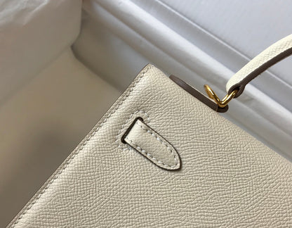 Hm Kelly 32 cm, cuero Epsom blanco, herrajes dorados