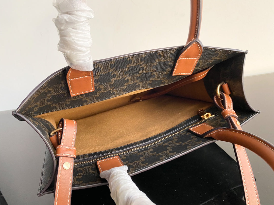 petit cabas vertical 28 cm toile triomphe noire cuir de veau beige