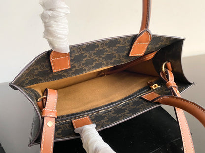 petit cabas vertical 28 cm toile triomphe noire cuir de veau beige
