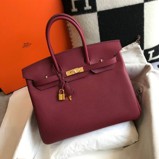 BOLSO HM BIRKIN DE 35 CM CON HERRAMIENTAS JAM TOGO DORADAS