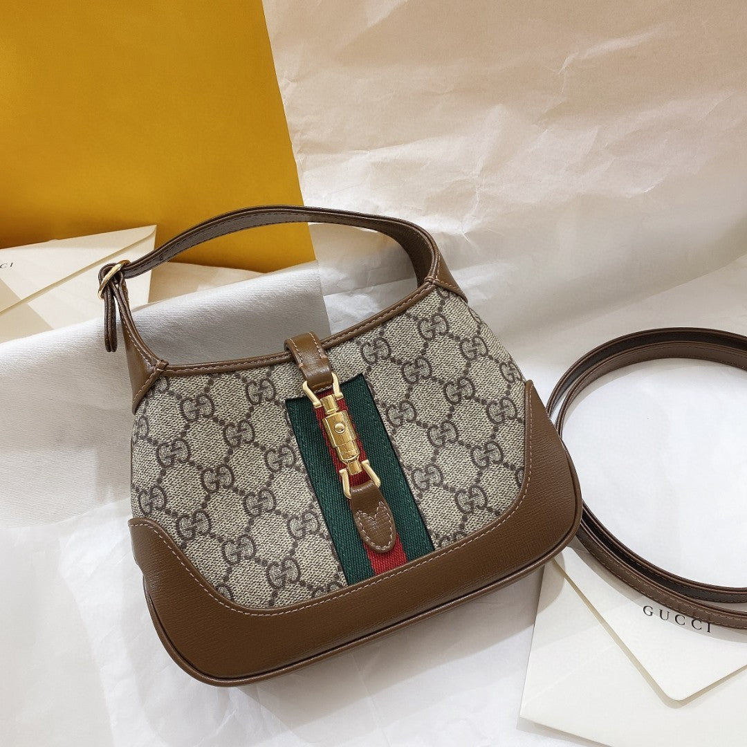 BOLSO DE HOMBRO JACKIE 1961 PEQUEÑO 28 EN LONA BEIGE Y PIEL DE BECERRO MARRÓN