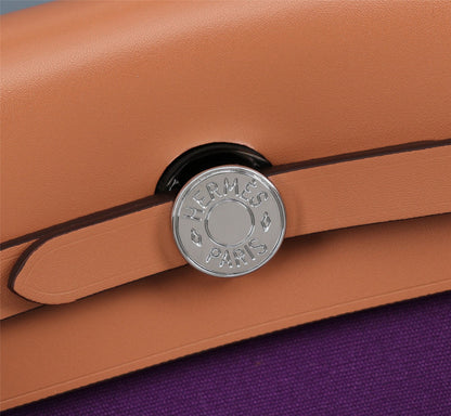 HM HERBAG ZIP 31 LONA VIOLETA Y COBRE