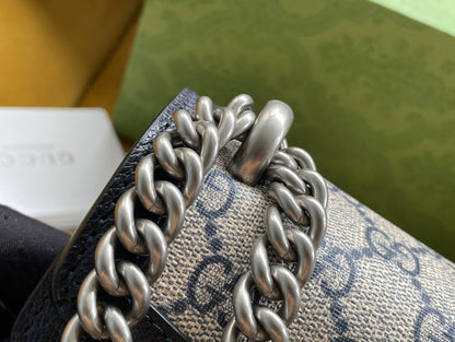 BOLSO DE HOMBRO DYONYSUS 25 EN TEJIDO JACQUARD BEIGE Y ADORNOS DE PIEL DE BECERRO NEGRA. HERRAJES PLATEADOS.