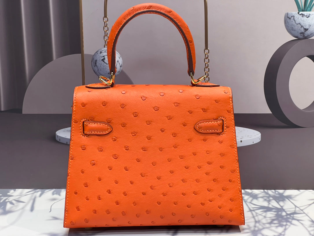BOLSO KELLY 20 EN PIEL DE AVESTRUZ NARANJA FUEGO CON HERRAJES DORADOS (HECHO BAJO PEDIDO)