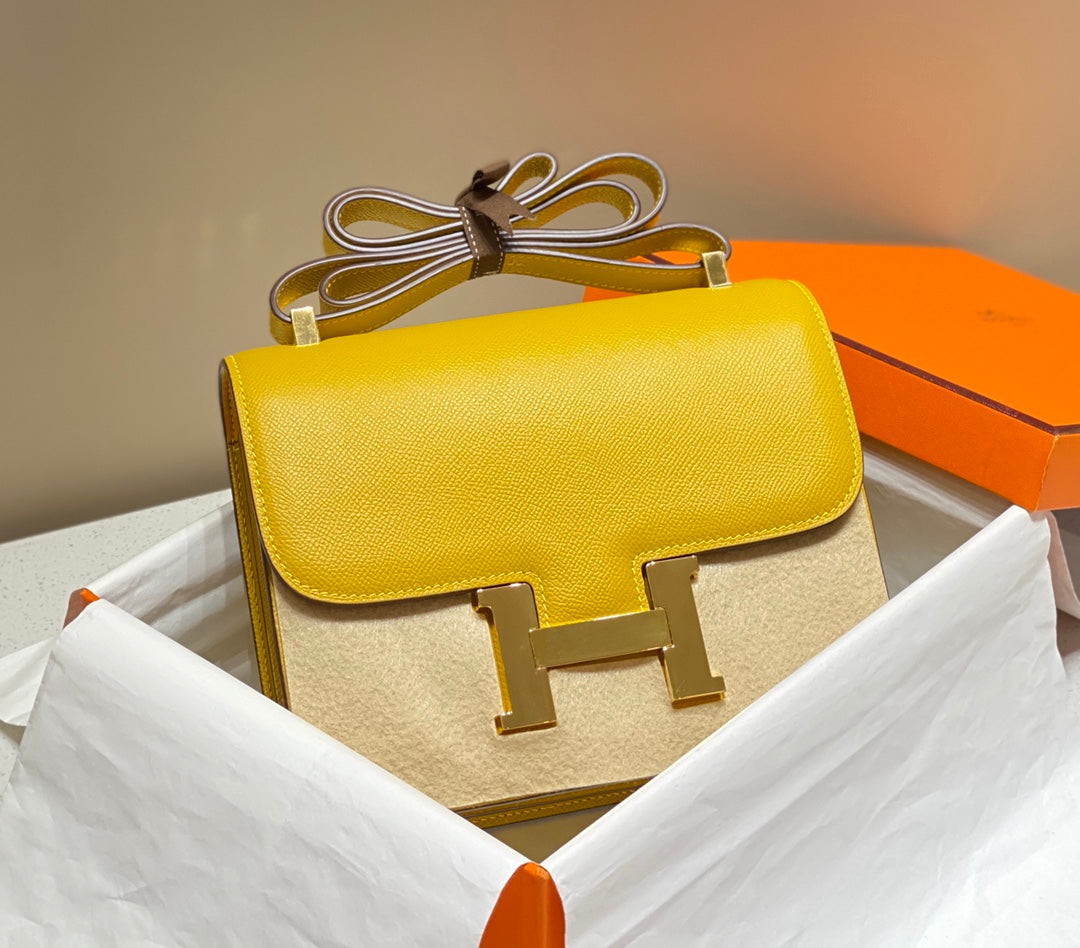 Constance 24, cuero Epsom amarillo, herrajes dorados
